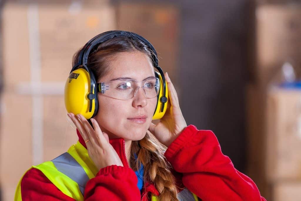 A woman using proper PPE for workplace safety